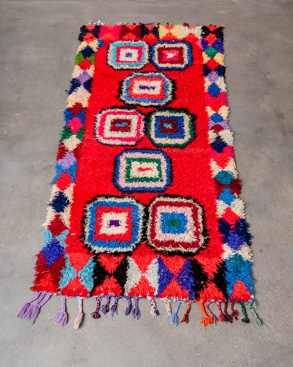 Modern designer vintage handcrafted Berber rug from Morocco. Boucherouite runner rug with beautiful colors and patterns.